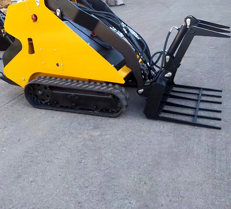 Tracked skid steer loader fitted with pallet forks